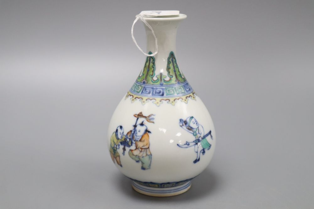 A Chinese doucai figurative bottle vase, bears Yongzheng mark, height 17cm
